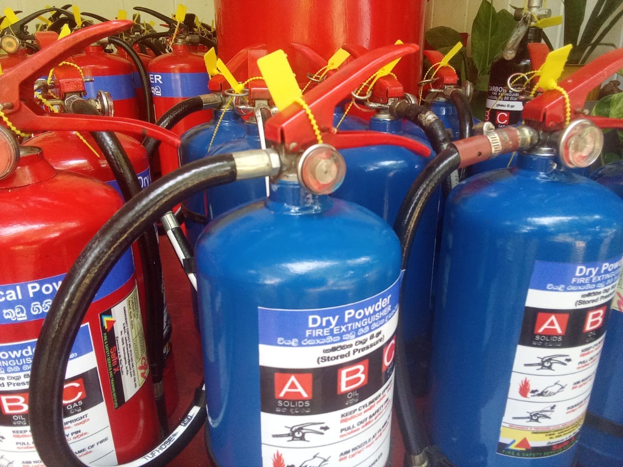 Close up of calibrated pressure gauges on dry chemical powder extinguishers
