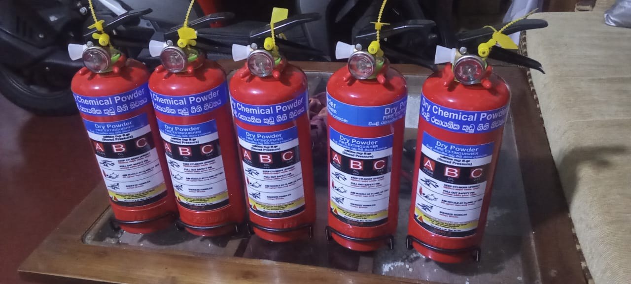 Row of certified ABC dry powder fire extinguishers ready for installation