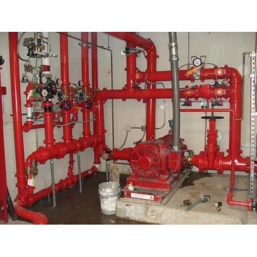 Commercial fire pump manifold with multi-riser distribution piping and pressure test gauges