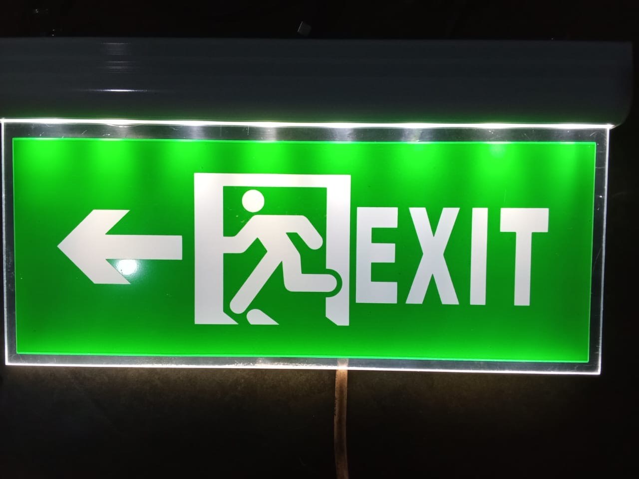 Architectural edge-lit acrylic directional emergency exit luminaire