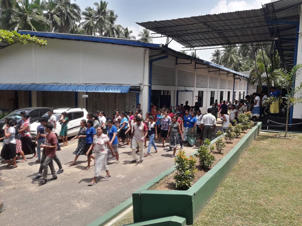 Industrial workforce participating in timed building evacuation drill